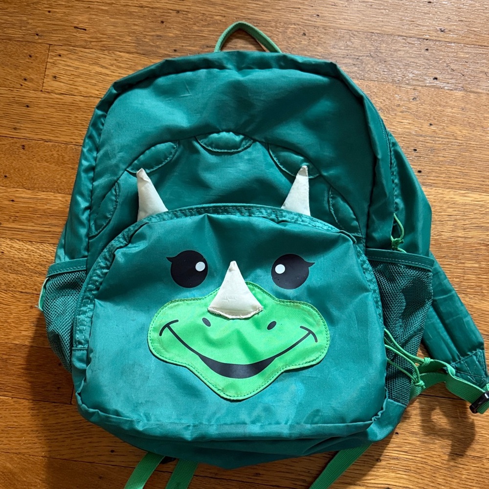 Green Dino Kids Backpack with Playful Rhinoceros Face